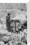 Mahra Bedouin with water-skins at ...