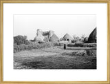 View of round huts and ...