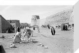 View of townspeople walking on ...