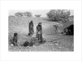 Wilfred Thesiger's party filling water-skins ...