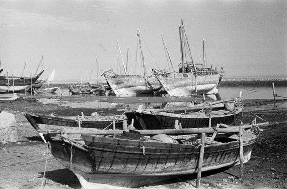 View of dhows (sailboats) beached ...