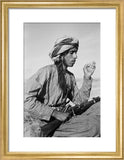 Seated profile portrait of Salim ...