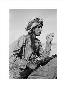 Seated profile portrait of Salim ...