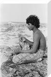 Seated profile portrait of Salim ...