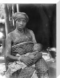 Asante mother with child at naming ceremony